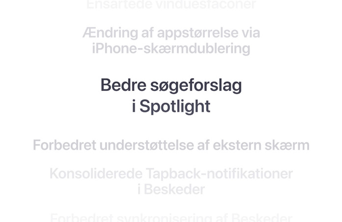 En lodret liste med funktioner, hvor “Bedre søgeforslag i Spotlight” står i fed skrift i midten. Omgivende funktioner lægger sig i baggrunden ovenover og nedenunder.