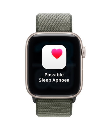 Apple Watch SE 3, aluminum case, starlight color, possible sleep apnoea notification, pink heart in white box, right side exterior, Digital Crown, Sport Loop, forest color