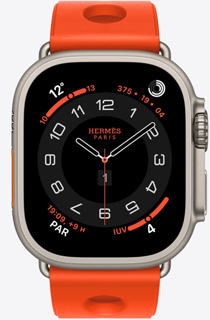 Apple Watch Hermès Ultra 3, quadrante analogico Circulaire, (lancette dell’ora, dei minuti e dei secondi, complicazioni: Meteo, anelli Attività, ora di Parigi e Indice UV), cassa in titanio naturale, lato destro, Digital Crown, tasto laterale in rilievo, cinturino Scub’H Diving color Orange Néon (arancione brillante) in gomma sagomata con aperture circolari al centro