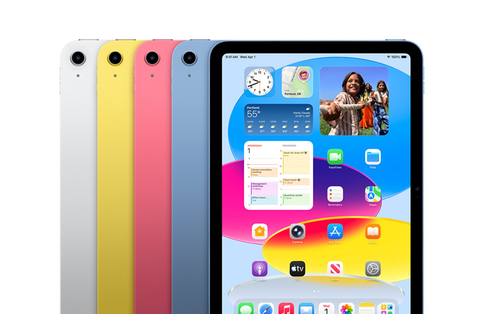 iPad devices lined up in four colours, silver, yellow, pink, blue, while screen shows wallpaper and variety of apps