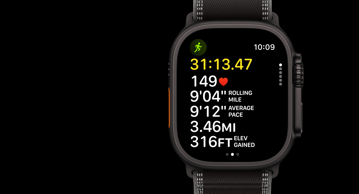 Apple Watch Ultra 3, black colour, titanium case, Workout app, Outdoor Run, left side exterior, Action button, right side exterior, Digital Crown, side button, strap, Trail Loop, black/charcoal colour